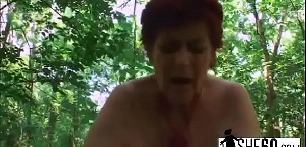  Chubby granny with huge dairy section is smacking a loaded penis in the woods